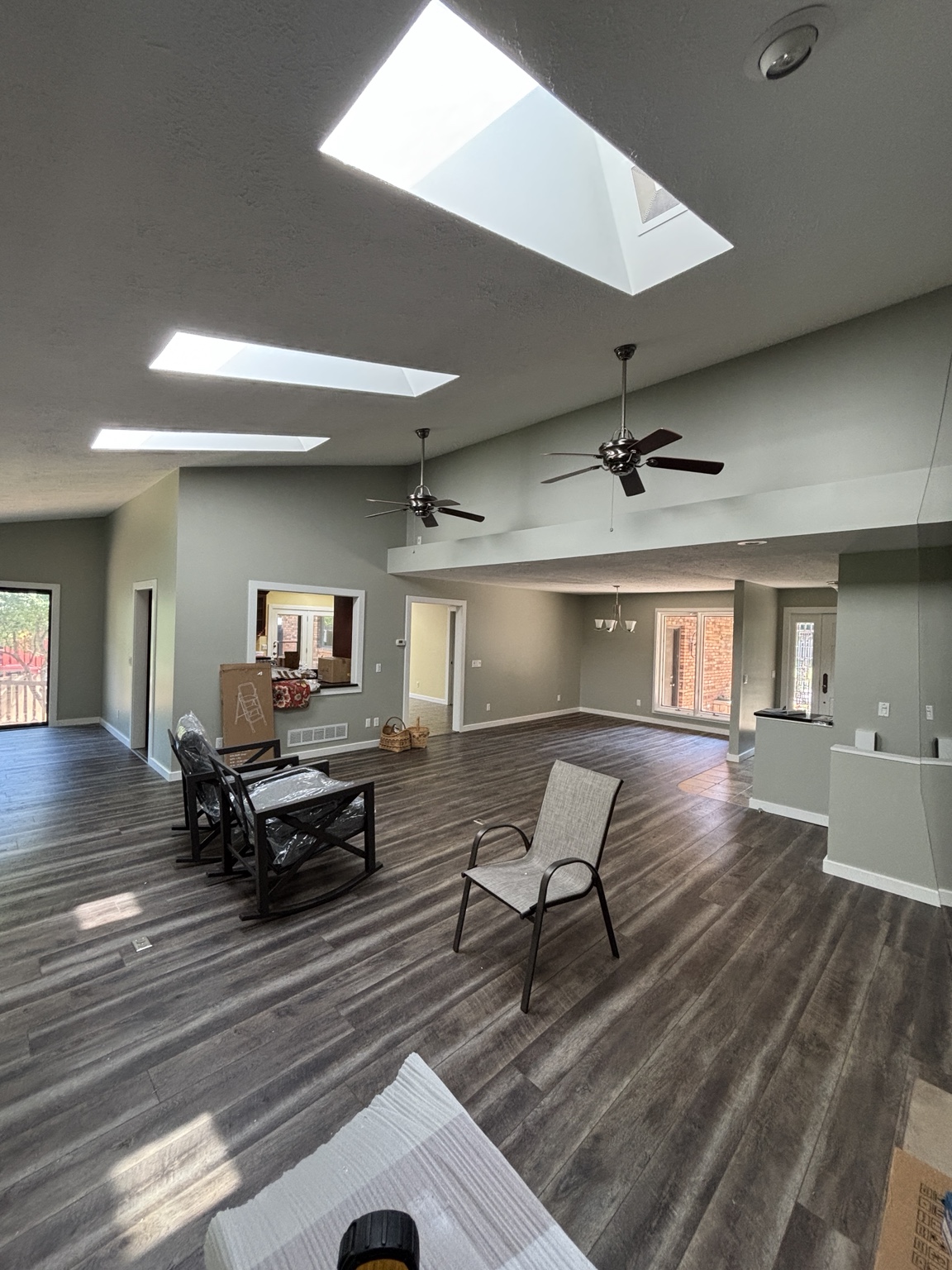 Finished open-plan interior with soft gray walls and bright white trim